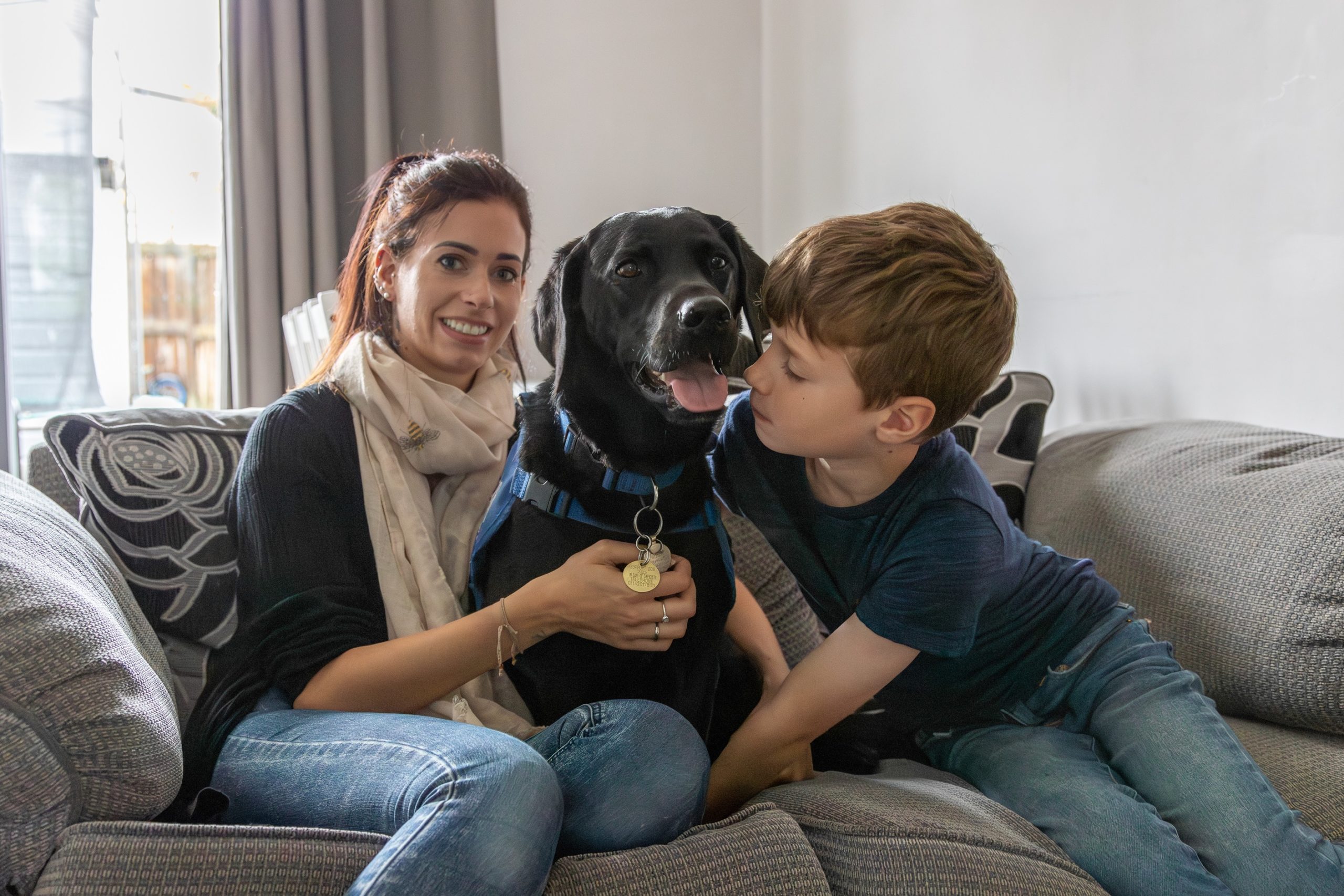Mum Rebecca with support dog Elvis and son Eli